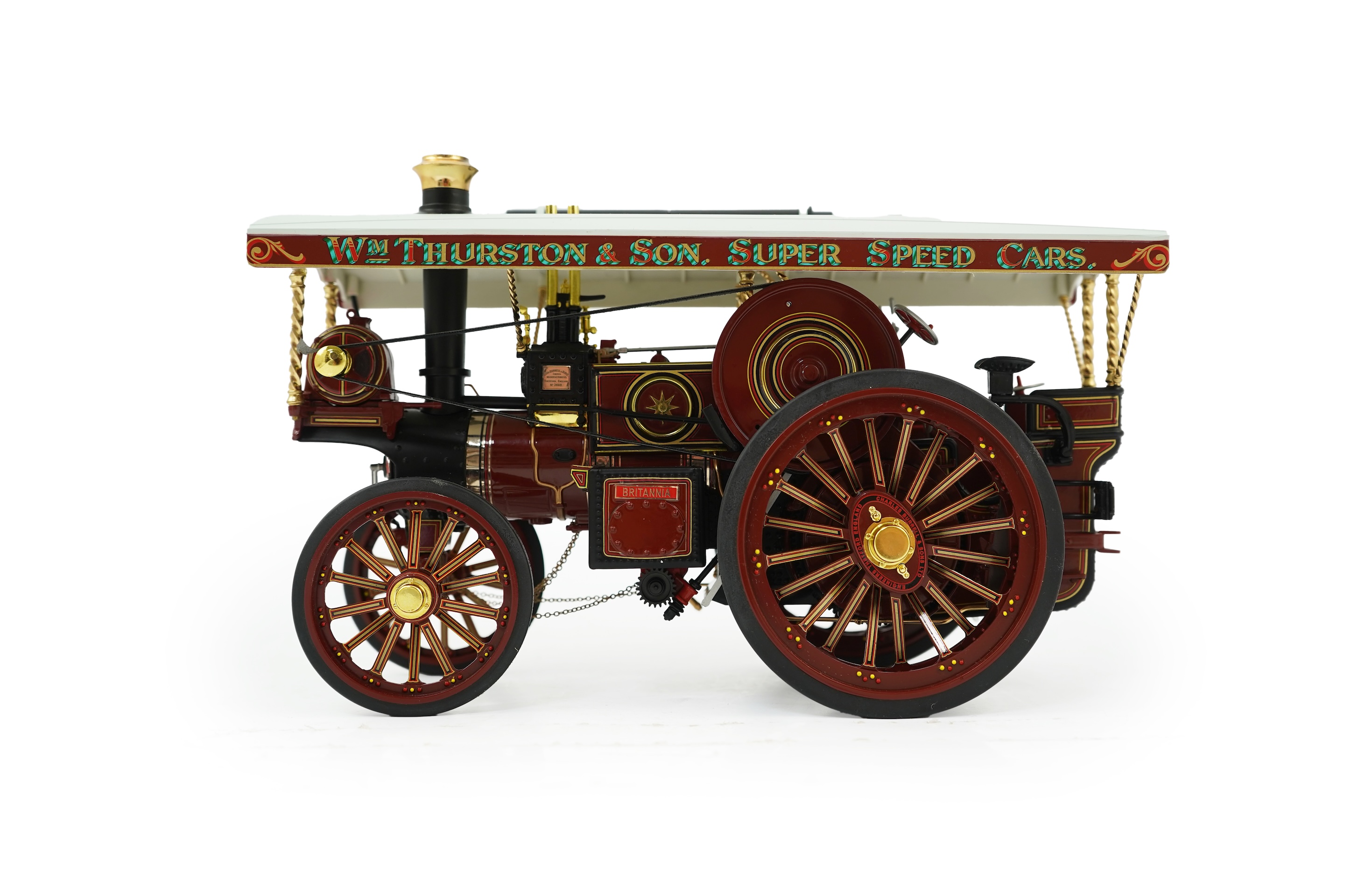 A Midsummer Models Ltd. 1:24 scale model of a Burrell Showman’s Engine, Britannia, in William Thurston and Son. Super Speed Cars livery, missing the original card box, but with an oak and Perspex display case